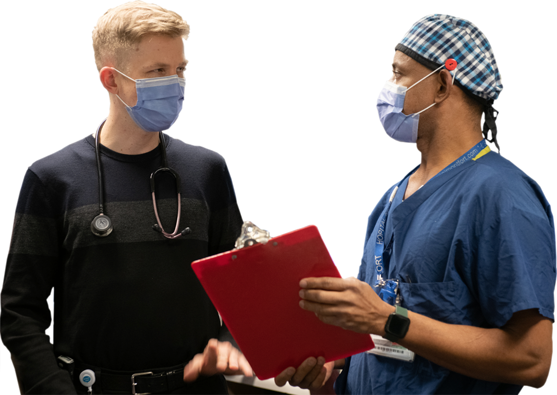 Two health professionals discussing holding a file