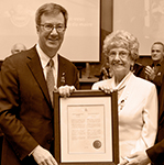 Jim Watson and Gisèle Lalonde holding a certificate